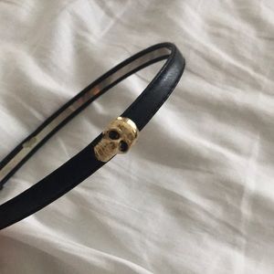 Black headband with gold skull